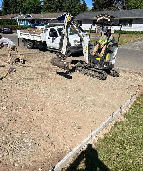 Broom finish driveway and decorate borders in Federal Way 